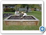 Karin Fields, an advocate of edible gardening, and her husband Scott Klarman switched from grass to vegetable gardens in planters in their Fort Lauderdale front yard several years ago and have not encountered any problems with the city. CHARLES TRAINOR JR / MIAMI HERALD STAFF